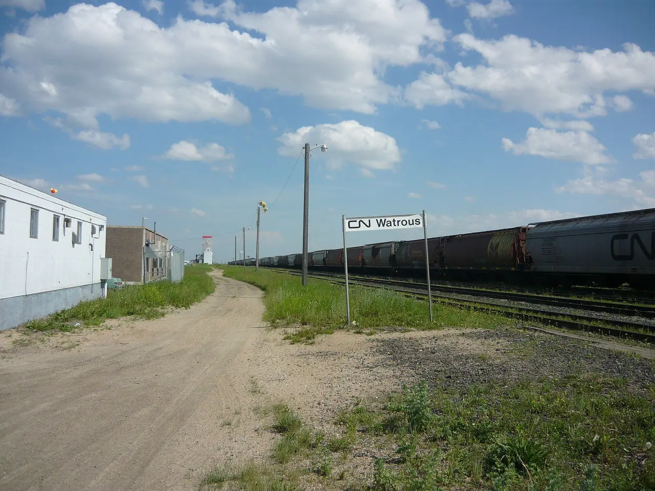 CN Watrous sign and grain cars beside the tracks, 2010
