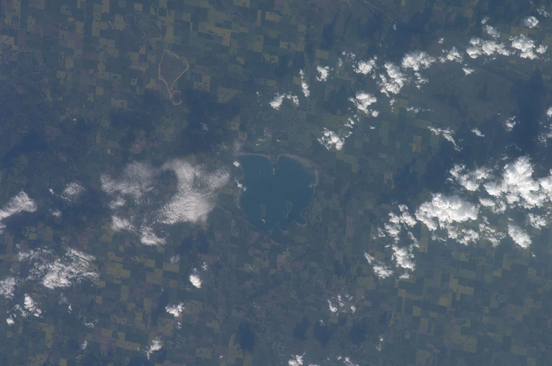 Aerial view of Manitou Lake and farmland from the ISS